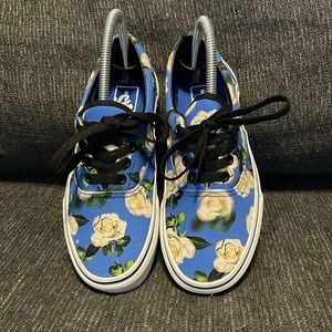 Van blue with white and yellow flowers.